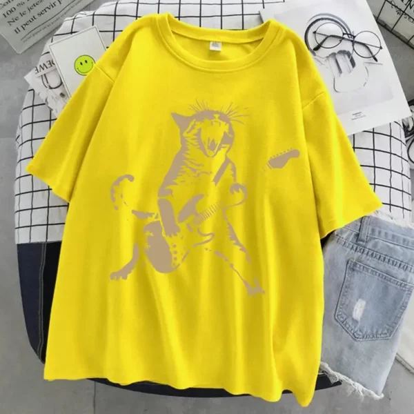Woman wearing a funny cat playing guitar t-shirt.