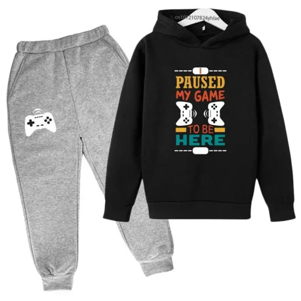 Kids gamer tracksuit set with 'I Paused My Game To Be Here' slogan on hooded sweatshirt and matching pants for boys or girls.