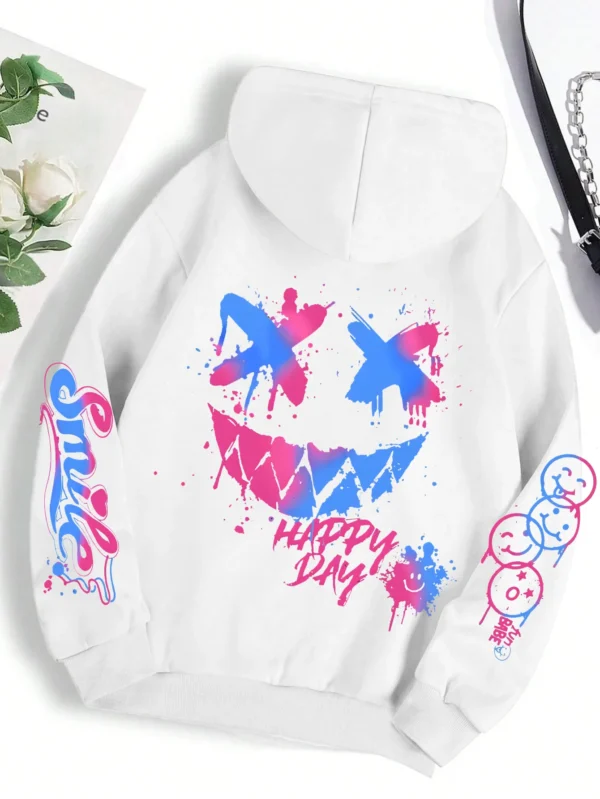Front view of a woman wearing the oversized graffiti print hoodie