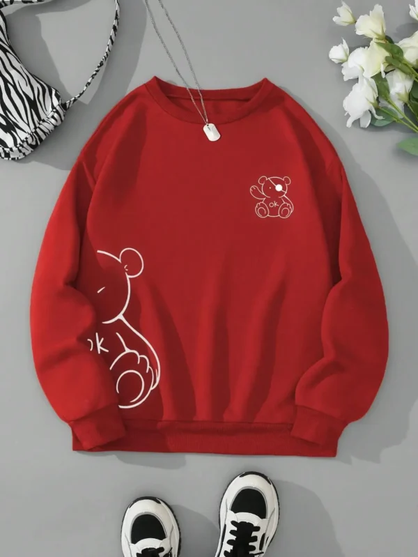 Women's retro beige fleece hoodie with a cute Kawaii teddy bear 'OK' print graphic on the front.