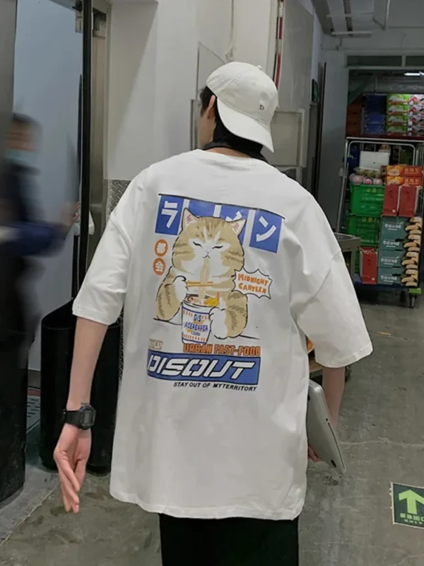 White oversized t-shirt with a cartoon graphic of a cute cat happily eating noodles from a bowl