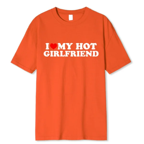 Person wearing funny black graphic tee with white 'I Love My Hot Girlfriend/Boyfriend' text print.