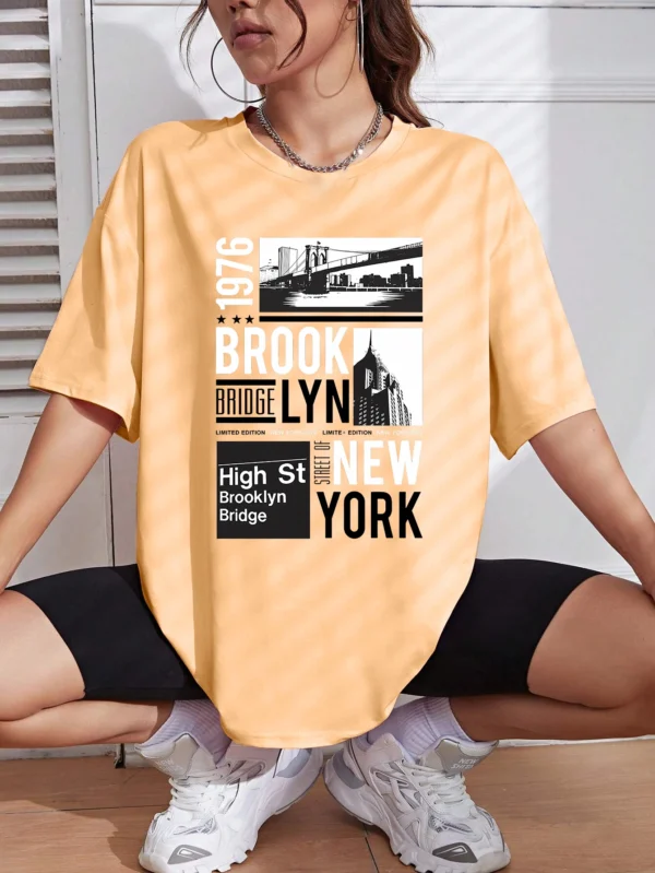 Woman wearing casual white t-shirt with retro "Brooklyn 1976 New York" graphic print.