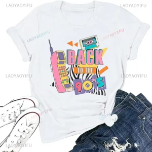 Woman wearing a white 'I Love The 90s / Take Me Back To The 90s' retro graphic tee against a plain background.