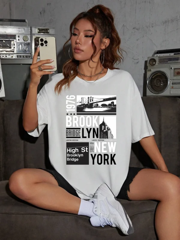 Woman wearing casual white t-shirt with retro "Brooklyn 1976 New York" graphic print.