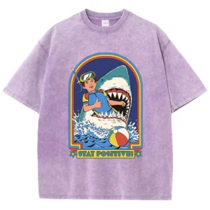 Woman wearing white O-neck t-shirt with colourful "Stay Positive" cartoon graphic print on the front.