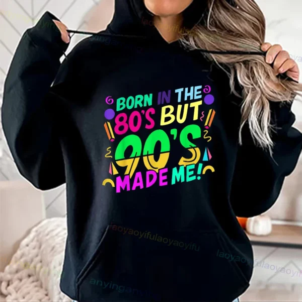 Woman wearing a vibrant neon hoodie with 'Take Me Back To The 90's' graphic print