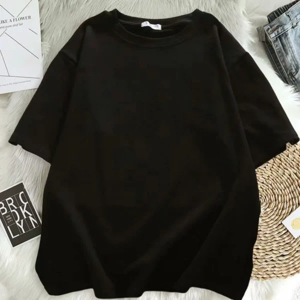 Women's short sleeve crew neck t-shirt with a colourful Kawaii style graphic print featuring a girl and sneakers motif. ```