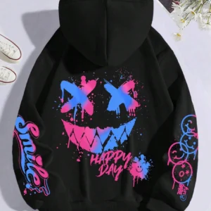 Front view of a woman wearing the oversized graffiti print hoodie