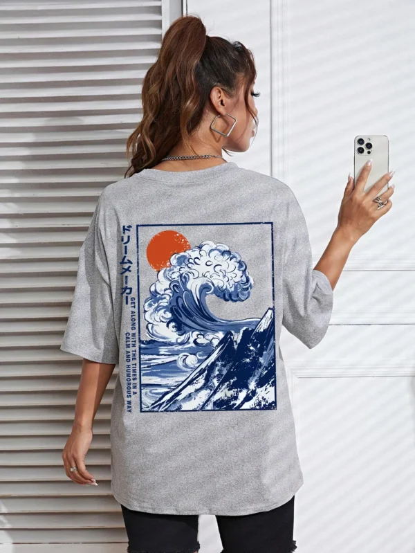 Women's cotton t-shirt featuring a vibrant Japanese wave and sunset graphic print. Relaxed fit.
