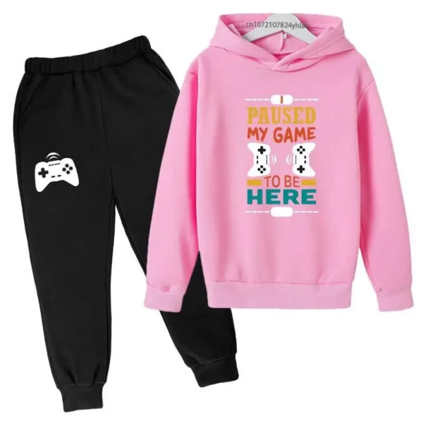 Kids gamer tracksuit set with 'I Paused My Game To Be Here' slogan on hooded sweatshirt and matching pants for boys or girls.