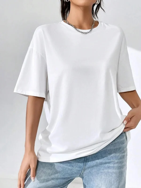 Women's cotton t-shirt featuring a vibrant Japanese wave and sunset graphic print. Relaxed fit.