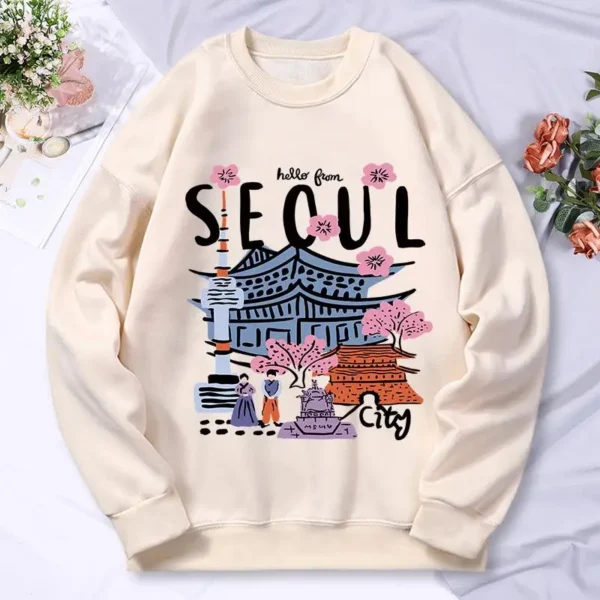 Woman wearing a warm casual hoodie with a colorful Seoul cityscape scenery print.