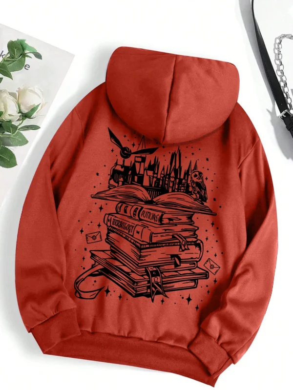 Woman wearing a cozy grey pullover hoodie with a humorous book-themed print on the front