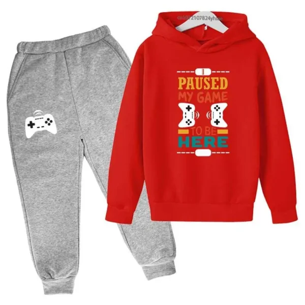 Kids gamer tracksuit set with 'I Paused My Game To Be Here' slogan on hooded sweatshirt and matching pants for boys or girls.