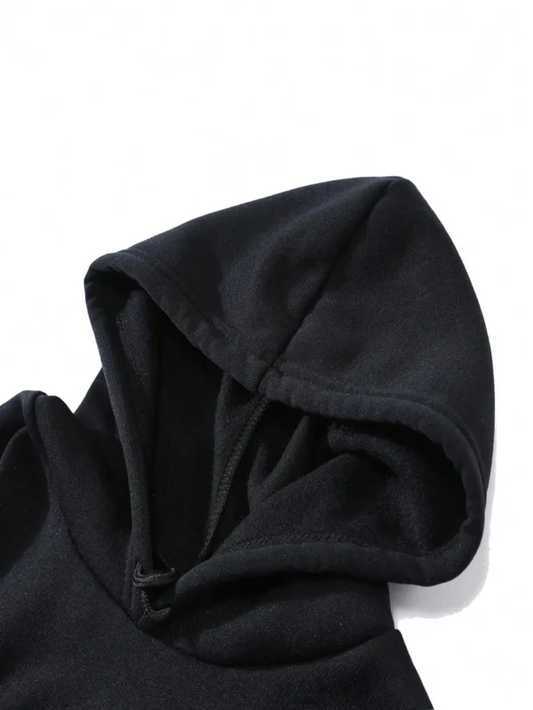 Woman wearing a "My Shadow Has Four Legs" fleece hoodie.