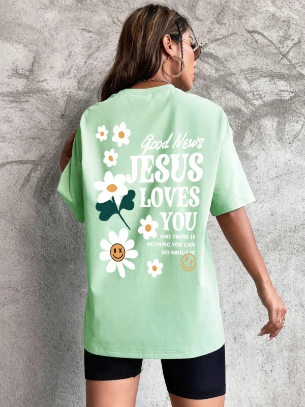 Woman wearing comfortable O-neck "Jesus Loves You" Christian graphic t-shirt for summer against a plain background.