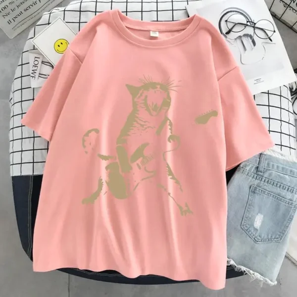 Woman wearing a funny cat playing guitar t-shirt.