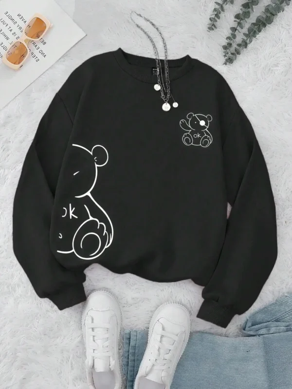 Women's retro beige fleece hoodie with a cute Kawaii teddy bear 'OK' print graphic on the front.