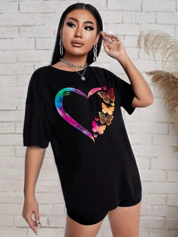 Woman modelling a comfortable butterfly print t-shirt and matching shorts set - summer casual wear.