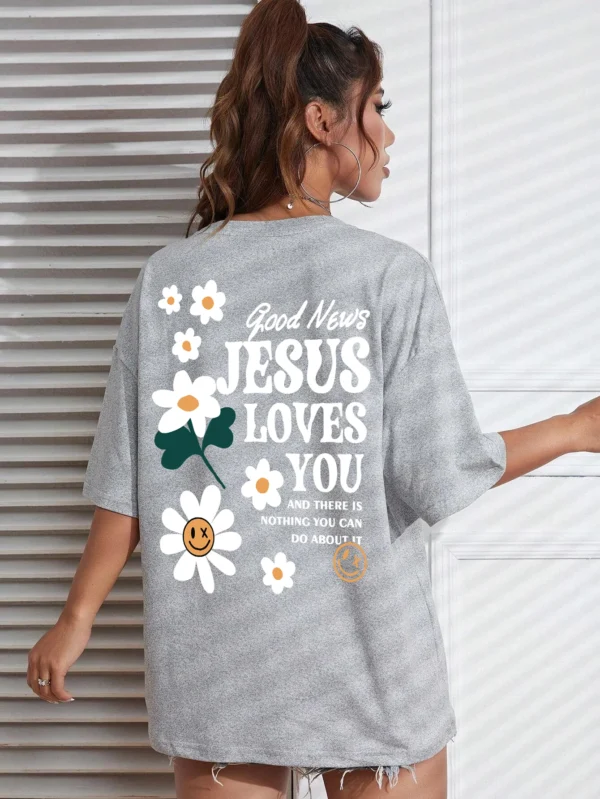 Woman wearing comfortable O-neck "Jesus Loves You" Christian graphic t-shirt for summer against a plain background.