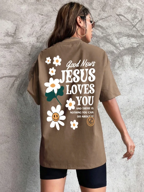 Woman wearing comfortable O-neck "Jesus Loves You" Christian graphic t-shirt for summer against a plain background.