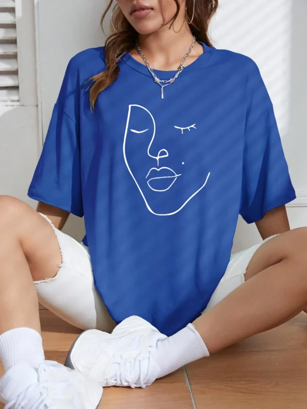 Woman wearing white cotton t-shirt with black minimalist line art face print. Casual short sleeve regular fit style. ```