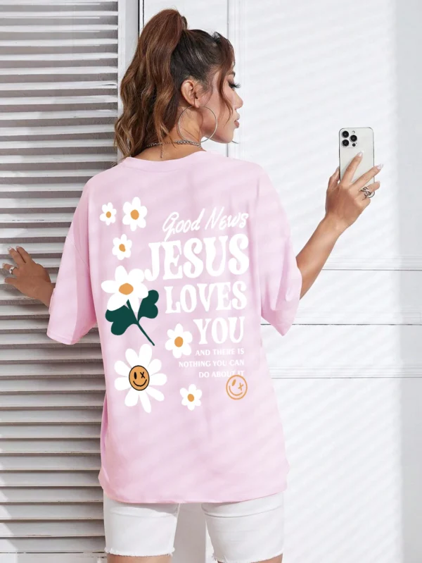 Woman wearing comfortable O-neck "Jesus Loves You" Christian graphic t-shirt for summer against a plain background.