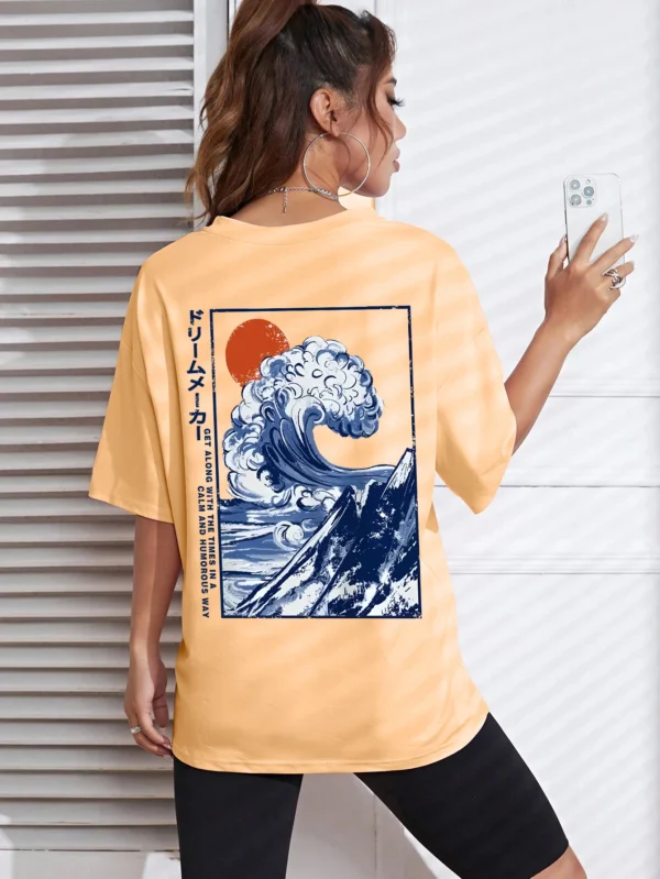 Women's cotton t-shirt featuring a vibrant Japanese wave and sunset graphic print. Relaxed fit.