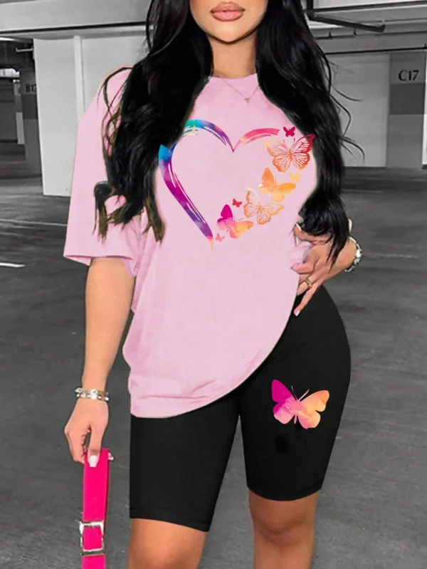 Woman modelling a comfortable butterfly print t-shirt and matching shorts set - summer casual wear.