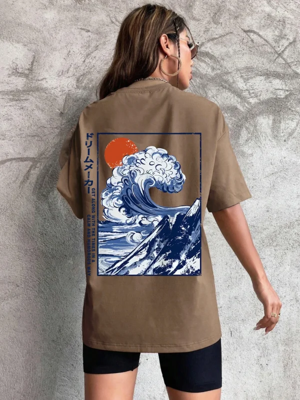 Women's cotton t-shirt featuring a vibrant Japanese wave and sunset graphic print. Relaxed fit.
