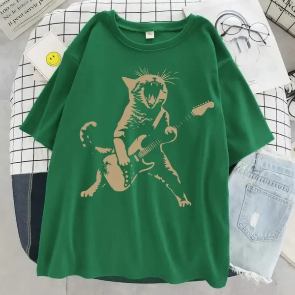 Woman wearing a funny cat playing guitar t-shirt.
