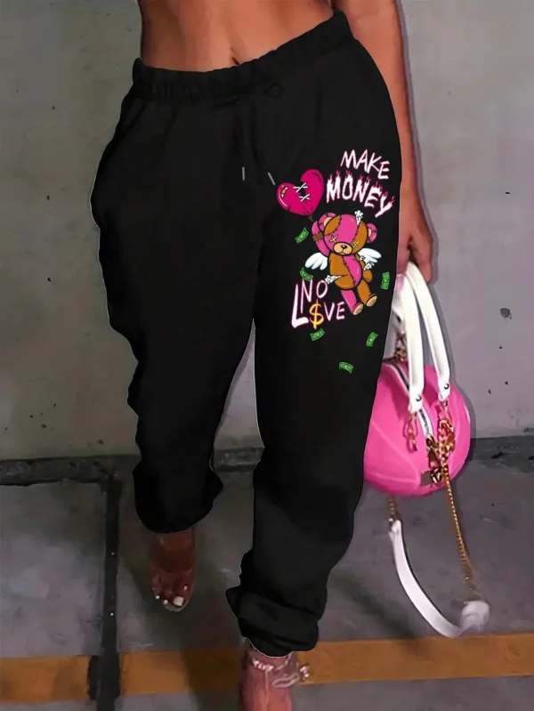Women's knit streetwear pants featuring a large cartoon bear graphic print on the leg - casual hip hop style.