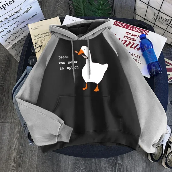 Woman wearing a black "Peace Was Never An Option" printed hoodie.