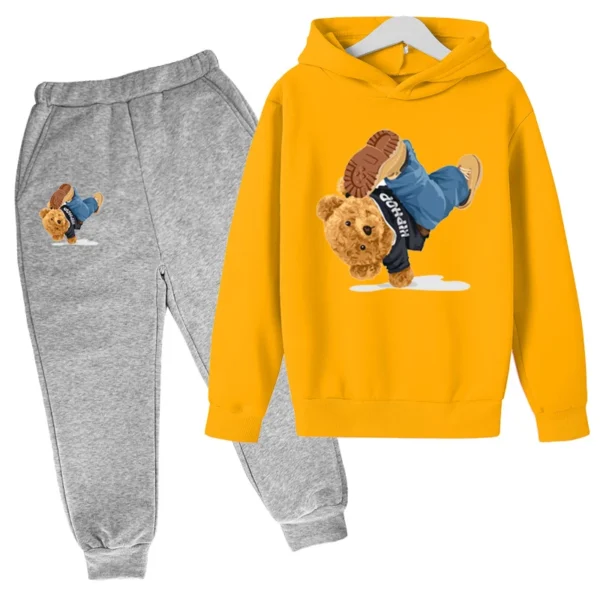 Child wearing fun cartoon bear print hooded tracksuit set with matching pants