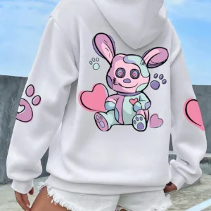 Woman wearing an oversized hoodie with a cute rabbit graphic print