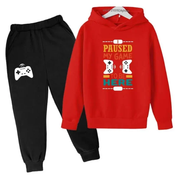 Kids gamer tracksuit set with 'I Paused My Game To Be Here' slogan on hooded sweatshirt and matching pants for boys or girls.