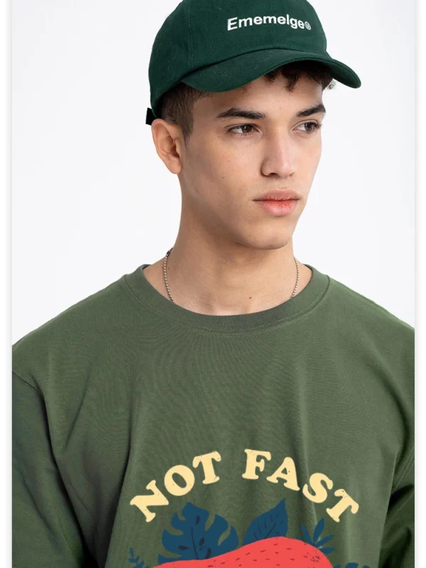 Model wearing funny 'Not Fast Not Furious' sloth graphic tee in breathable cotton. Unisex casual summer style.