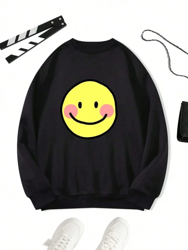 Women's oversized crewneck sweatshirt in a neutral color with a large black cute smile cartoon print on the front.