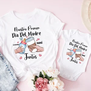 Mom in custom name t-shirt smiles beside baby wearing matching personalized 'Our First Mother's Day' bodysuit.