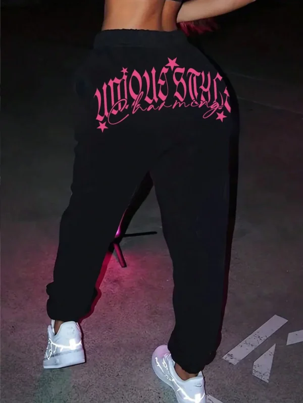 Women's pink loose casual hip hop pants with white letter print graphic - streetwear style trousers for autumn/winter.