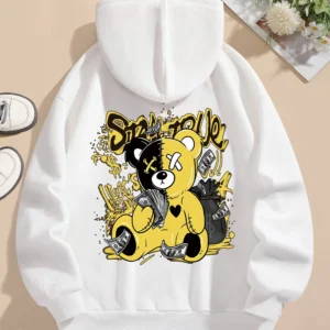 Woman wearing oversized fleece hoodie with large bear cartoon print - Harajuku streetwear style.