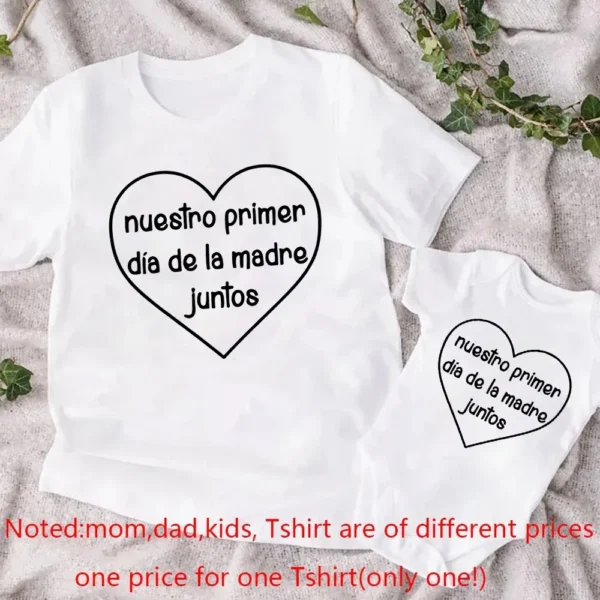 Mom and baby wearing matching white 'Our First Mother's Day' t-shirt and bodysuit outfit set.