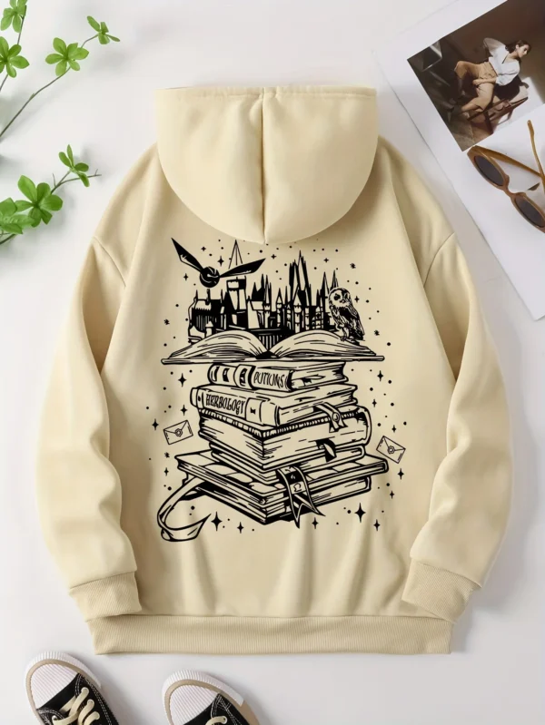 Woman wearing a cozy grey pullover hoodie with a humorous book-themed print on the front
