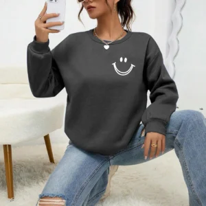 Women's O-neck fleece sweatshirt featuring a smiling face graphic print