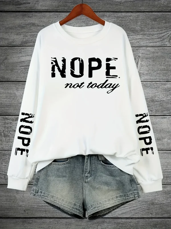 Woman wearing a "Nope Not Today" retro print sweatshirt.