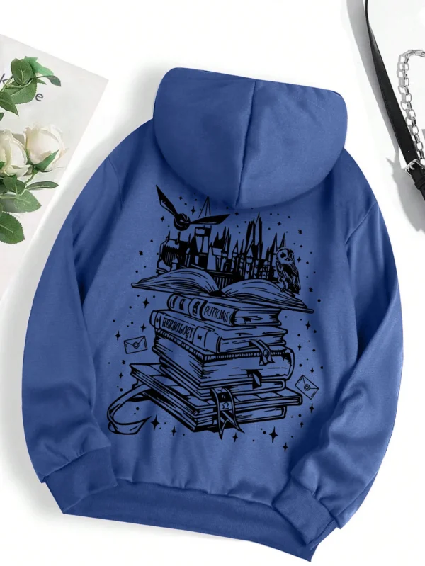 Woman wearing a cozy grey pullover hoodie with a humorous book-themed print on the front