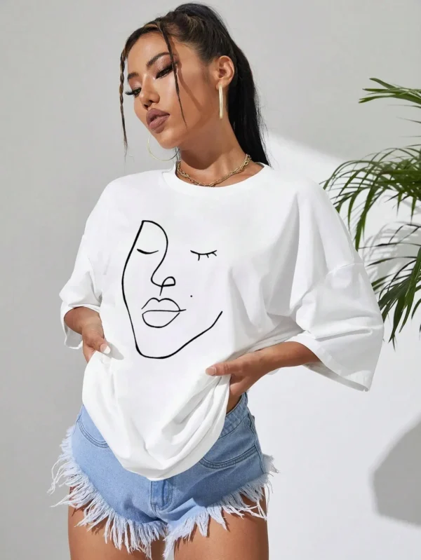 Woman wearing white cotton t-shirt with black minimalist line art face print. Casual short sleeve regular fit style. ```