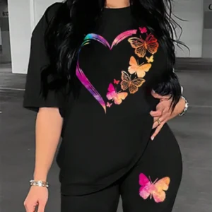 Woman modelling a comfortable butterfly print t-shirt and matching shorts set - summer casual wear.