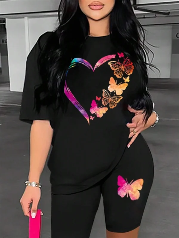 Woman modelling a comfortable butterfly print t-shirt and matching shorts set - summer casual wear.